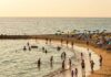 Top 10 Family-Friendly Beaches for Your Next Vacation Family fun on a bright beach.